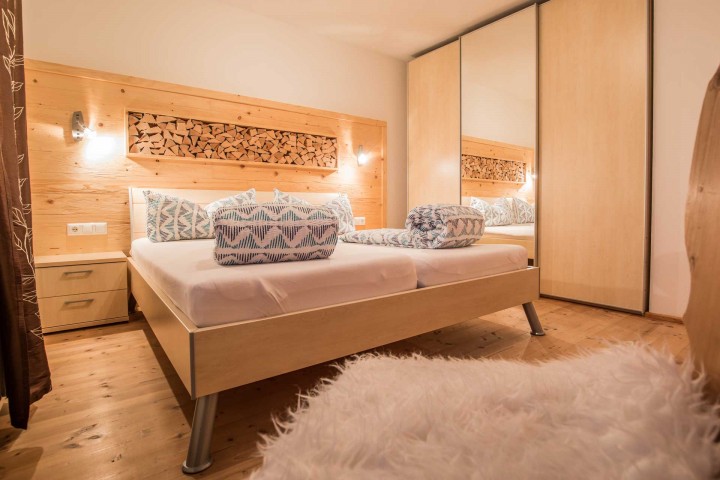 Vacation apartment in the Stubai Valley, Tyrol - Double room made of Swiss stone pine with private balcony and flat-screen TV in the Morgentau vacation apartment